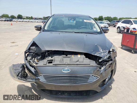 2017 Ford Focus Titanium with VIN 1FADP3J20HL253446, listed as a Copart auction lot 64196895 with 150,633 mi miles and Salvage title. Bid and sale history available at DreamBid. Image 5.