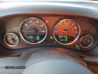 2011 Jeep Wrangler Sahara with VIN 1J4GA5D14BL628876, listed as a Copart auction lot 87317374 with 84,179 mi miles and Salvage Title. Bid and sale history available at DreamBid. Image 9.