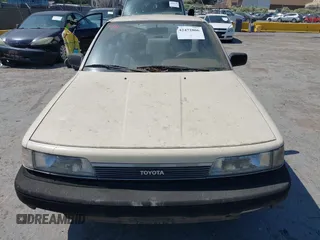 1987 Toyota Camry z VIN JT2SV21EXH3130273, wystawiony jako IAAI lot #42472806 z przebiegiem 124 958 mil mil oraz . Historia ofert i sprzedaży dostępna na DreamBid. Obrazek 6.