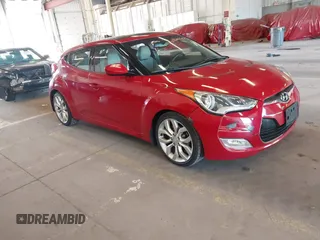 2012 Hyundai Veloster w/Gray Int z VIN KMHTC6AD3CU023998, wystawiony jako IAAI lot #42186875 z przebiegiem 170 771 mil mil oraz . Historia ofert i sprzedaży dostępna na DreamBid. Obrazek 1.