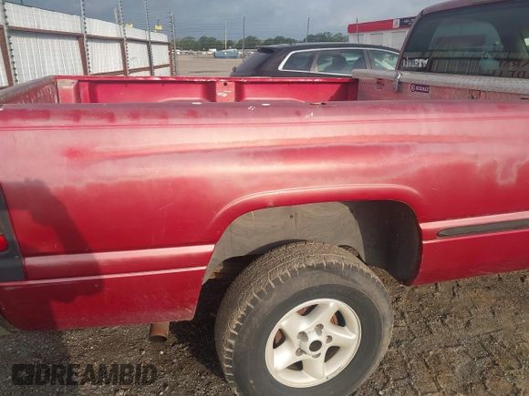 1999 Dodge 1500 z VIN 1B7HF16Y2XS185896, wystawiony jako IAAI lot #42251046 z przebiegiem 258 932 mil mil oraz . Historia ofert i sprzedaży dostępna na DreamBid. Obrazek 14.
