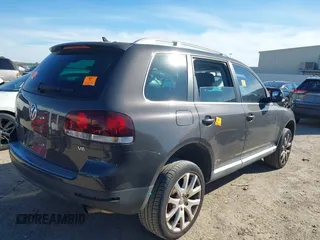 2010 Volkswagen Touareg VR6 with VIN WVGBF7A95AD002412, listed as a IAAI auction lot 41259491 with 94,104 mi miles and . Bid and sale history available at DreamBid. Image 4.