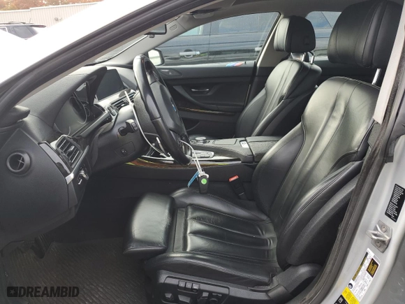 2016 BMW 6 Series 650i xDrive with VIN WBA6D6C52GG387898, listed as a Copart auction lot 77109254 with 106,134 mi miles and Salvage Title. Bid and sale history available at carsss.com. Image 7.