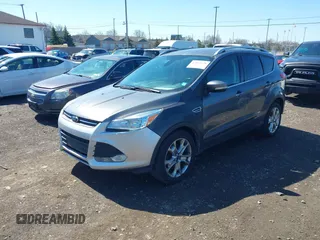 2014 Ford Escape Titanium with VIN 1FMCU9JX1EUB94776, listed as a IAAI auction lot 42063678 with 138,036 mi miles. Bid and sale history available at carsss.com. Image 17.