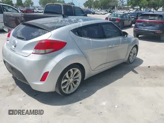 2012 Hyundai Veloster w/Gray Int with VIN KMHTC6ADXCU028115, listed as a IAAI auction lot 42361550 with 118,920 mi miles and . Bid and sale history available at DreamBid. Image 4.