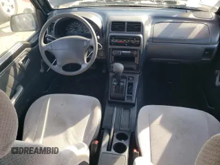 1998 Suzuki Sidekick JS z VIN 2S3TE02V1W6402490, wystawiony jako Copart lot #78316244 z przebiegiem 79 724 mil mil oraz Tytuł czysty. Historia ofert i sprzedaży dostępna na DreamBid. Obrazek 8.