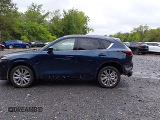 2023 Mazda CX-5 Signature with VIN JM3KFBXY4P0153335, listed as a IAAI auction lot 40053867 with 17,828 mi miles and . Bid and sale history available at carsss.com. Image 14.