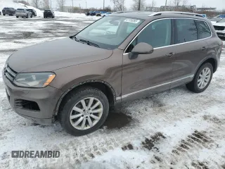 2012 Volkswagen Touareg Sport with VIN WVGEF9BP8CD006057, listed as a Copart auction lot 47739265 with 213,580 mi miles and Salvage Title. Bid and sale history available at DreamBid. Image 1.