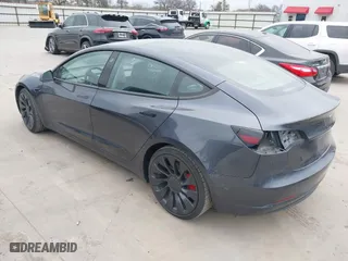 2022 Tesla Model 3 Performance with VIN 5YJ3E1EC9NF130410, listed as a IAAI auction lot 41711708 with 26,937 mi miles. Bid and sale history available at carsss.com. Image 3.