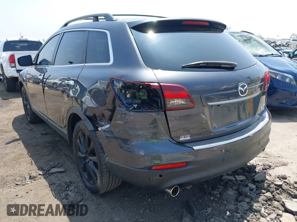 2015 Mazda CX-9 Grand Touring with VIN JM3TB3DA0F0459024, listed as a IAAI auction lot 42452288 with 174,716 mi miles and . Bid and sale history available at DreamBid. Image 3.
