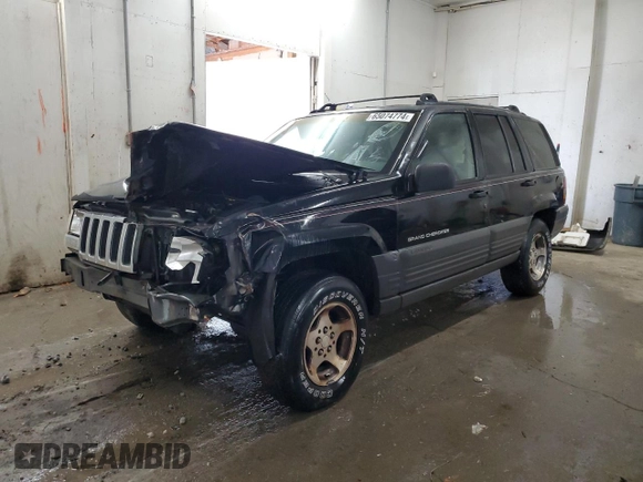 1996 Jeep Grand Cherokee Laredo with VIN 1J4GZ58S0TC402024, listed as a Copart auction lot 65074774 with 163,477 mi miles and Salvage Title. Bid and sale history available at carsss.com. Image 1.