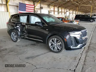 2020 Cadillac XT6 FWD Premium Luxury with VIN 1GYKPCRS8LZ149860, listed as a Copart auction lot 61108985 with 58,459 mi miles and Salvage title. Bid and sale history available at DreamBid. Image 4.