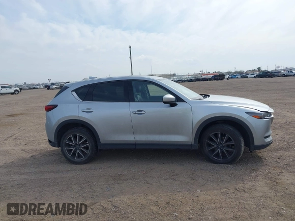 2017 Mazda CX-5 Grand Touring with VIN JM3KFBDL8H0227348, listed as a IAAI auction lot 41572377 with 124,908 mi miles. Bid and sale history available at carsss.com. Image 13.