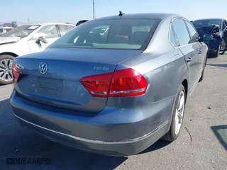 2015 Volkswagen Passat 1.8T Sport with VIN 1VWBT7A36FC020582, listed as a IAAI auction lot 41625054 with 98,613 mi miles. Bid and sale history available at carsss.com. Image 4.