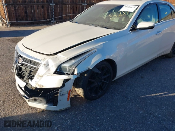 2014 Cadillac CTS Luxury AWD z VIN 1G6AX5SX3E0149360, wystawiony jako IAAI lot #41020479 z przebiegiem 98 917 mil mil oraz . Historia ofert i sprzedaży dostępna na DreamBid. Obrazek 6.