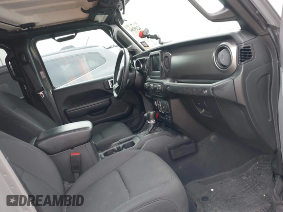2022 Jeep Gladiator Texas Trail z VIN 1C6HJTAG2NL176011, wystawiony jako IAAI lot #42193864 z przebiegiem 27 219 mil mil oraz . Historia ofert i sprzedaży dostępna na DreamBid. Obrazek 5.
