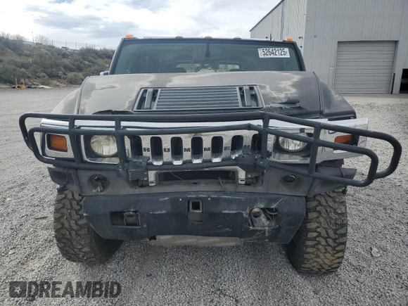 2004 Hummer H2 z VIN 5GRGN23U74H100175, wystawiony jako Copart lot #52642125 z przebiegiem 112 305 mil mil oraz Szkoda całkowita • Salvage title. Historia ofert i sprzedaży dostępna na DreamBid. Obrazek 5.