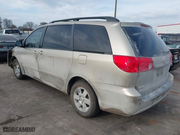 2010 Toyota Sienna CE with VIN 5TDKK4CC9AS311702, listed as a IAAI auction lot 41586415 with 206,453 mi miles. Bid and sale history available at carsss.com. Image 3.