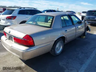 1998 Mercury Grand Marquis LS with VIN 2MEFM75W7WX665734, listed as a IAAI auction lot 41390381 with 74,385 mi miles. Bid and sale history available at carsss.com. Image 4.