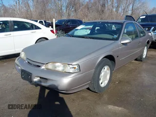 1995 Ford Thunderbird LX with VIN 1FALP62W9SH206490, listed as a IAAI auction lot 41744430 with 111,365 mi miles. Bid and sale history available at carsss.com. Image 2.