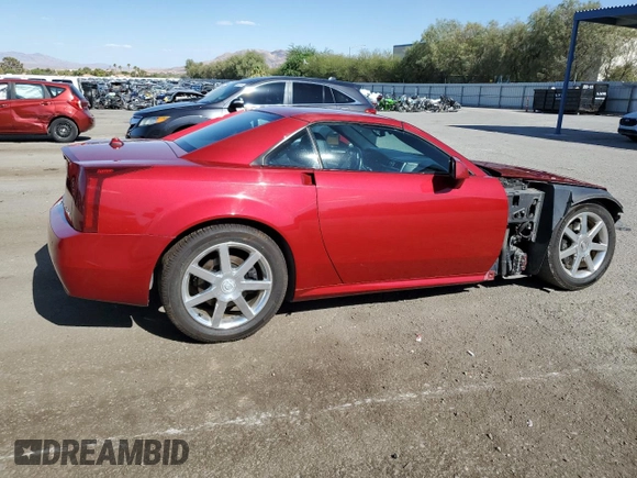 2004 Cadillac XLR z VIN 1G6YV34A345600127, wystawiony jako Copart lot #68859774 z przebiegiem 40 727 mil mil oraz Szkody całkowita. Historia ofert i sprzedaży dostępna na DreamBid. Obrazek 3.