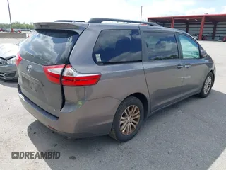2015 Toyota Sienna XLE with VIN 5TDYK3DC3FS556859, listed as a IAAI auction lot 42161107 with 200,502 mi miles and . Bid and sale history available at DreamBid. Image 4.