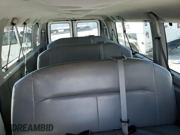 2009 Ford Econoline Passenger XL with VIN 1FBSS31L99DA06824, listed as a Copart auction lot 73740824 with 147,528 mi miles and Salvage title. Bid and sale history available at DreamBid. Image 10.