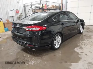2018 Ford Fusion SE z VIN 3FA6P0LU3JR203864, wystawiony jako IAAI lot #41476335 z przebiegiem 49 246 mil mil oraz . Historia ofert i sprzedaży dostępna na DreamBid. Obrazek 4.