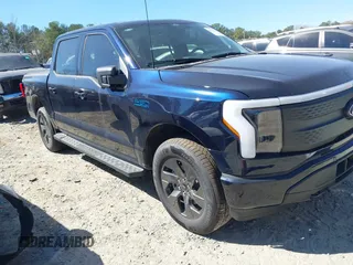 2024 Ford F-150 Lightning Flash with VIN 1FT6W3L75RWG30755, listed as a IAAI auction lot 41817158 with 1,932 mi miles and . Bid and sale history available at DreamBid. Image 1.
