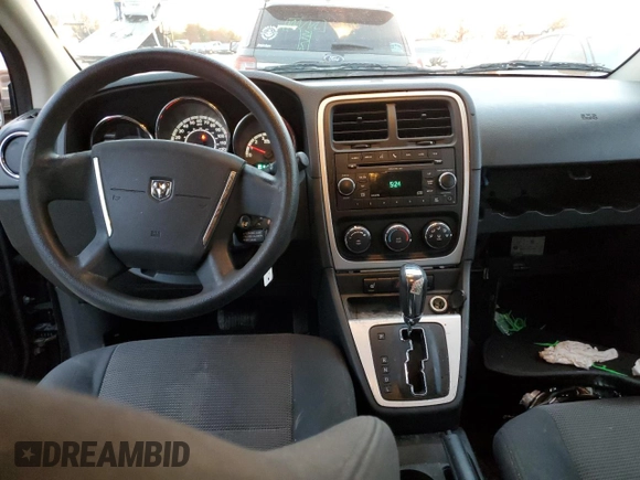 2010 Dodge Caliber Mainstreet z VIN 1B3CB3HAXAD551716, wystawiony jako Copart lot #77349503 z przebiegiem 144 209 mil mil oraz Tytuł czysty. Historia ofert i sprzedaży dostępna na DreamBid. Obrazek 8.