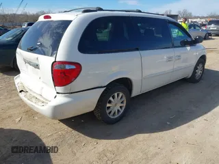 2003 Chrysler Town & Country LX with VIN 2C4GP44L33R117314, listed as a IAAI auction lot 41674437 with Not Provided miles and . Bid and sale history available at DreamBid. Image 4.