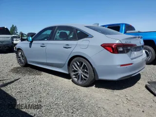 2022 Honda Civic Touring with VIN 2HGFE1F90NH319961, listed as a Copart auction lot 57799335 with 36,458 mi miles and Salvage title. Bid and sale history available at DreamBid. Image 2.