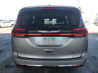 2021 Chrysler Pacifica Hybrid Touring L with VIN 2C4RC1L7XMR593911, listed as a Copart auction lot 57842415 with 74,910 mi miles and Salvage title. Bid and sale history available at DreamBid. Image 6.