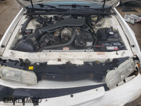 1994 Ford Thunderbird LX with VIN 1FALP62W5RH211700, listed as a Copart auction lot 72046634 with 61,570 mi miles and Salvage Title. Bid and sale history available at DreamBid. Image 11.
