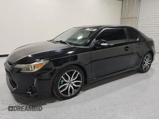 2014 Scion tC z VIN JTKJF5C74E3082080, wystawiony jako Copart lot #54212115 z przebiegiem 134 015 mil mil oraz Czysty tytuł • Clean title. Historia ofert i sprzedaży dostępna na DreamBid. Obrazek 1.