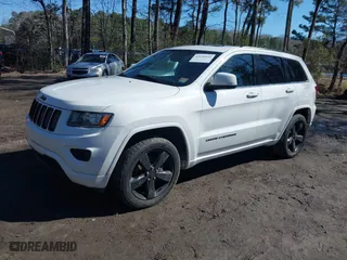 2015 Jeep Grand Cherokee Altitude with VIN 1C4RJFAG4FC924869, listed as a IAAI auction lot 41656444 with 112,786 mi miles. Bid and sale history available at carsss.com. Image 2.