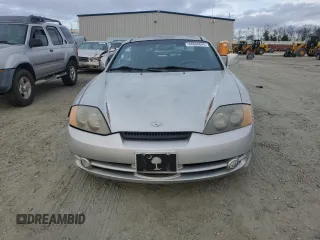 2003 Hyundai Tiburon GT z VIN KMHHN65F63U064962, wystawiony jako Copart lot #44804045 z przebiegiem 186 171 mil mil oraz Szkoda całkowita • Salvage title. Historia ofert i sprzedaży dostępna na DreamBid. Obrazek 5.