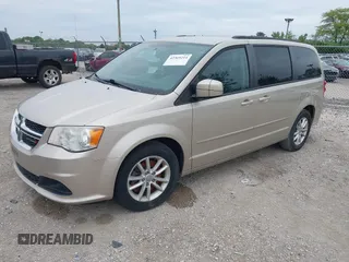 2014 Dodge Grand Caravan SXT z VIN 2C4RDGCG2ER372983, wystawiony jako IAAI lot #42369214 z przebiegiem 148 756 mil mil oraz . Historia ofert i sprzedaży dostępna na DreamBid. Obrazek 2.