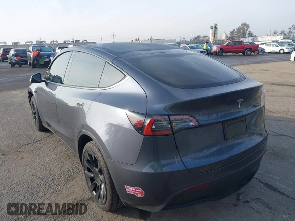 2023 Tesla Model Y Long Range with VIN 7SAYGDEE7PA196038, listed as a IAAI auction lot 41459601 with 16,489 mi miles and . Bid and sale history available at DreamBid. Image 3.