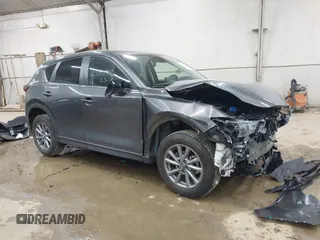 2023 Mazda CX-5 S Carbon Edition z VIN JM3KFBCM8P0211207, wystawiony jako IAAI lot #42383512 z przebiegiem Nie podano mil oraz . Historia ofert i sprzedaży dostępna na DreamBid. Obrazek 1.
