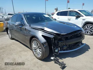 2019 Infiniti Q50 Luxe with VIN JN1EV7AP4KM517649, listed as a IAAI auction lot 41648242 with 125,634 mi miles and . Bid and sale history available at DreamBid. Image 1.