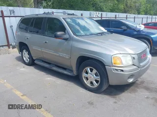 2003 GMC Envoy SLE with VIN 1GKDT13S532285819, listed as a IAAI auction lot 42602777 with 209,908 mi miles and . Bid and sale history available at DreamBid. Image 1.