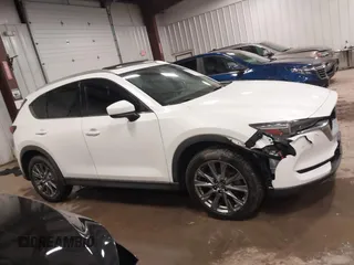 2019 Mazda CX-5 Signature with VIN JM3KFBEY5K0520593, listed as a IAAI auction lot 41638594 with 111,504 mi miles. Bid and sale history available at carsss.com. Image 13.
