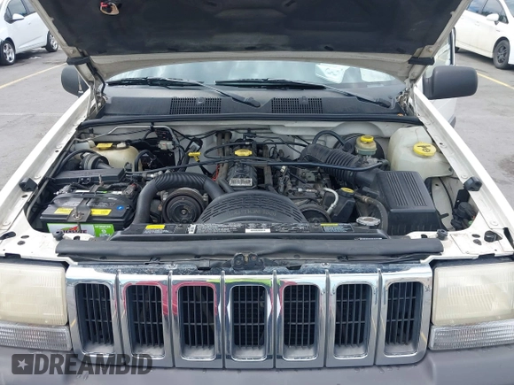1996 Jeep Grand Cherokee Laredo with VIN 1J4FX58S5TC388512, listed as a IAAI auction lot 42803796 with 147,732 mi miles and . Bid and sale history available at DreamBid. Image 10.