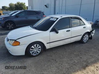 1999 Mazda Protege DX with VIN JM1BJ2224X0107532, listed as a Copart auction lot 73541684 with 214,226 mi miles and Salvage Title. Bid and sale history available at DreamBid. Image 1.