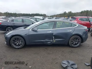 2019 Tesla Model 3 Mid Range with VIN 5YJ3E1EA3KF307415, listed as a IAAI auction lot 41673239 with 42,895 mi miles and . Bid and sale history available at DreamBid. Image 14.