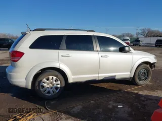2017 Dodge Journey SE z VIN 3C4PDCAB3HT707029, wystawiony jako IAAI lot #41406306 z przebiegiem 104 046 mil mil oraz . Historia ofert i sprzedaży dostępna na DreamBid. Obrazek 14.