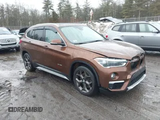 2016 BMW X1 xDrive28i with VIN WBXHT3C31GP881488, listed as a IAAI auction lot 41693116 with 120,922 mi miles. Bid and sale history available at carsss.com. Image 1.