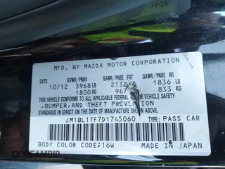 2013 Mazda 3 i SV with VIN JM1BL1TF7D1745060, listed as a IAAI auction lot 41985303 with 132,625 mi miles. Bid and sale history available at carsss.com. Image 9.