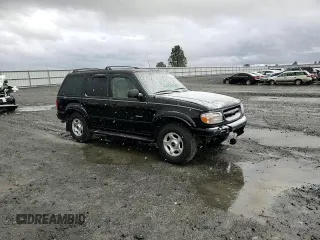 2000 Ford Explorer Limited with VIN 1FMDU75EXYZA76329, listed as a Copart auction lot 80952474 with 90,637 mi miles and Salvage title. Bid and sale history available at DreamBid. Image 12.